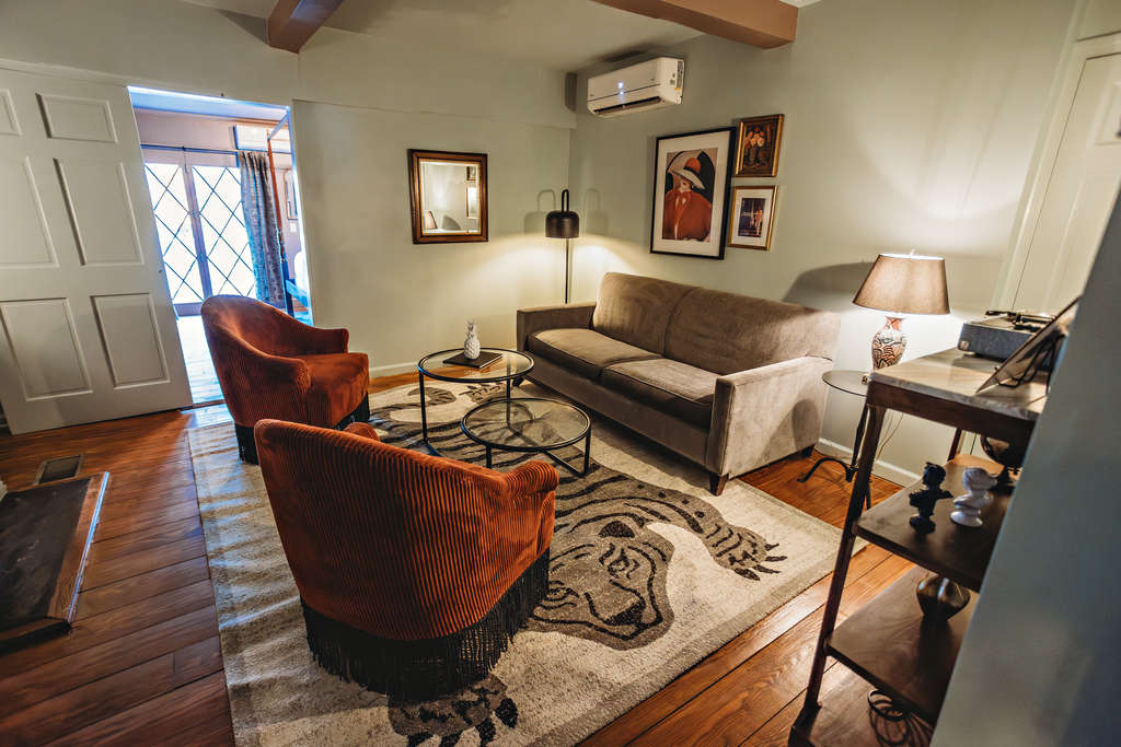 Comfortable living room featuring stylish furniture and artwork.